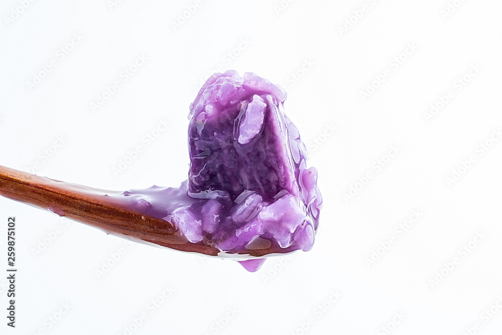 a spoonful of purple yam porridge close-up