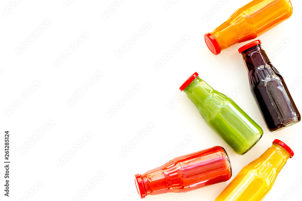 healthy organic juice in bottles for fitness diet and detox on white background top view mockup