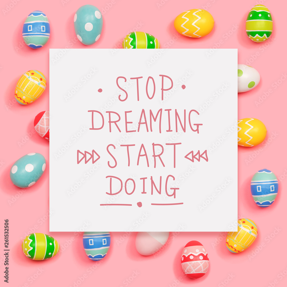 Stop dreaming start doing message with Easter eggs on a pink background