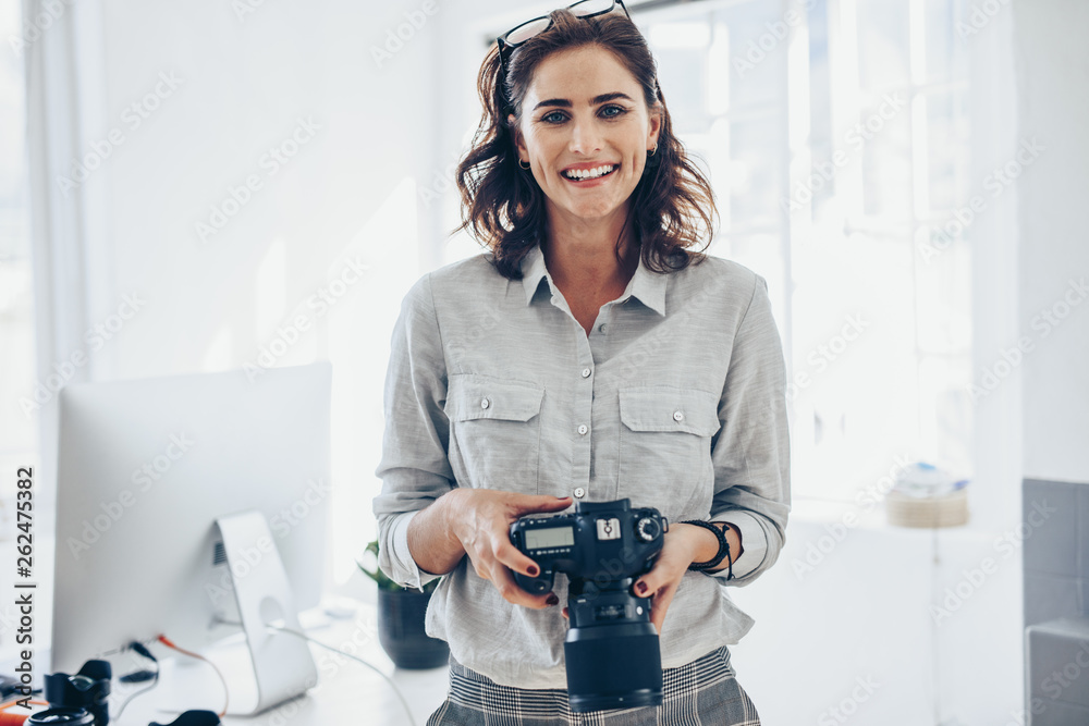 Attractive young woman photographer