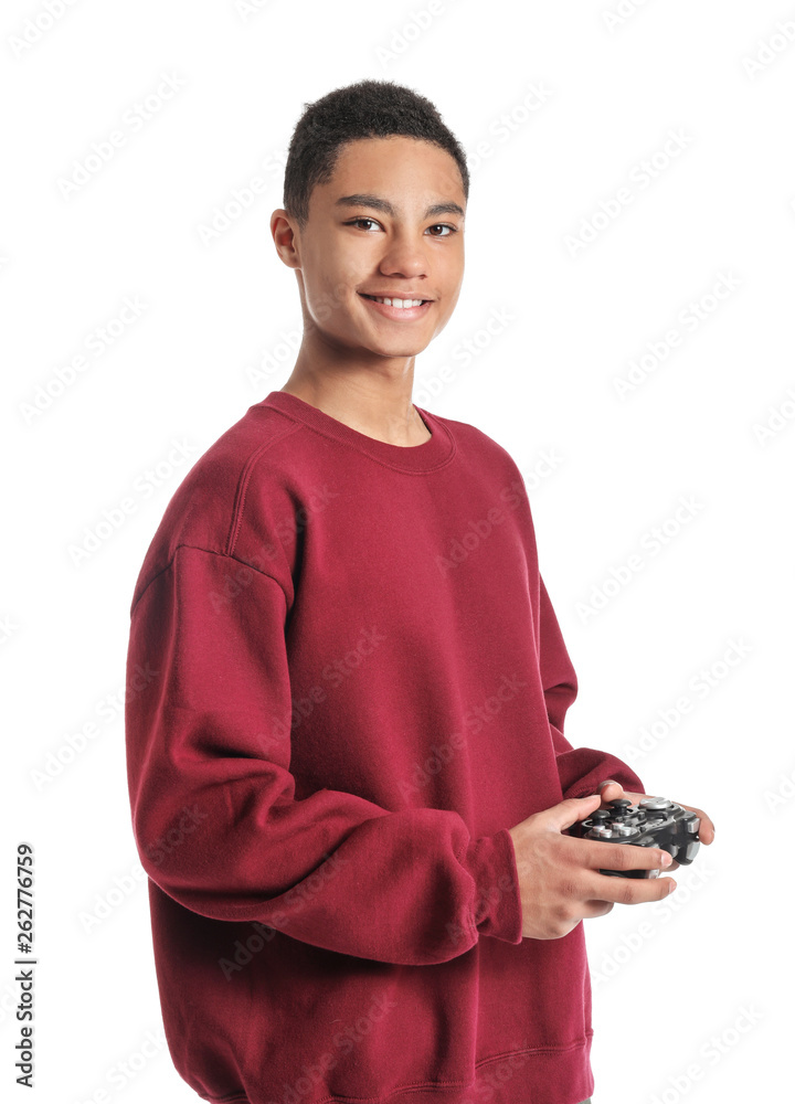 Portrait of African-American teenage boy playing video games on white background