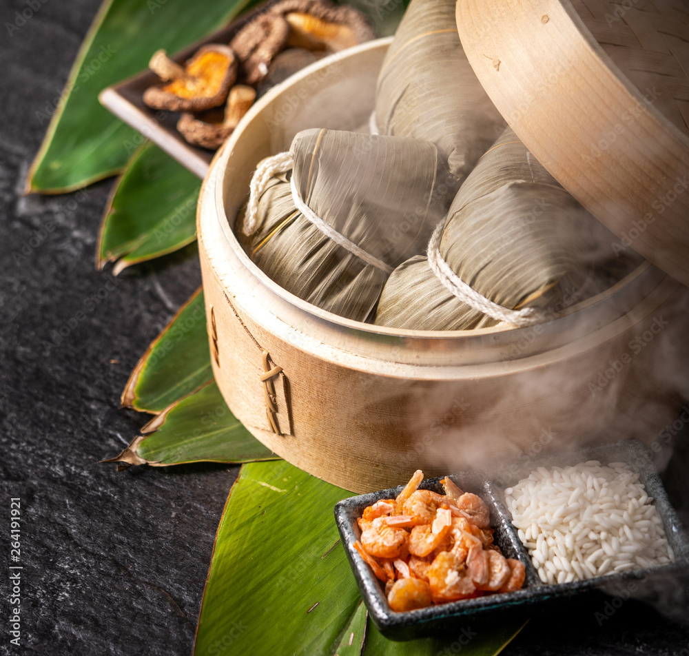 Zongzi, delicious fresh hot steamed rice dumplings in steamer. Close up, copy space, famous asian ta