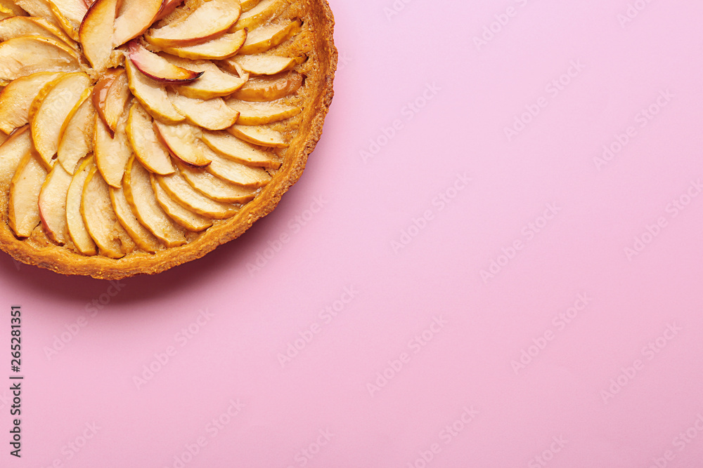Tasty apple pie on color background
