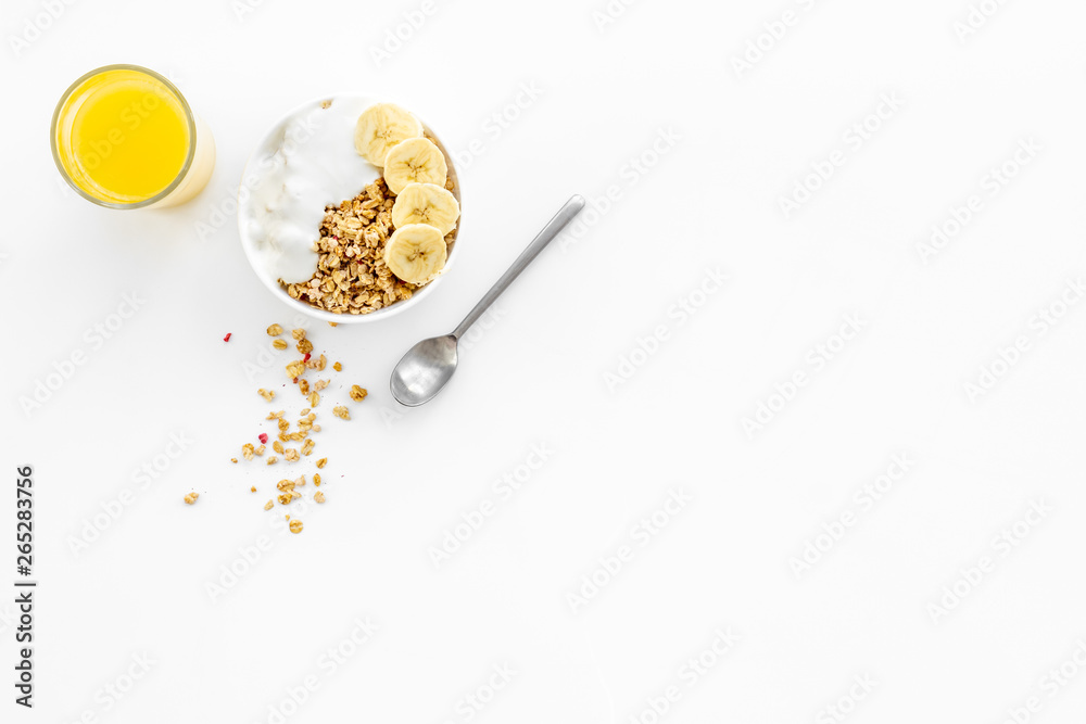 Bright breakfast with granola and orange juice on white background top view mockup