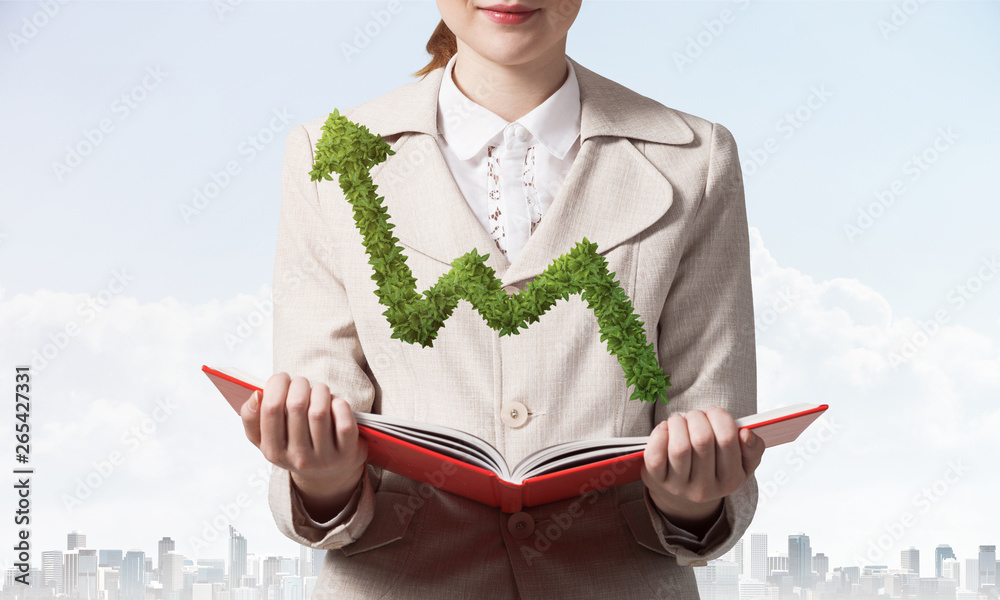 Woman with green plant shaped growing arrow