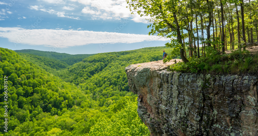 Tourist visitors couple taking pictures at Whitaker Point rock cliff hiking trail, landscape view, O