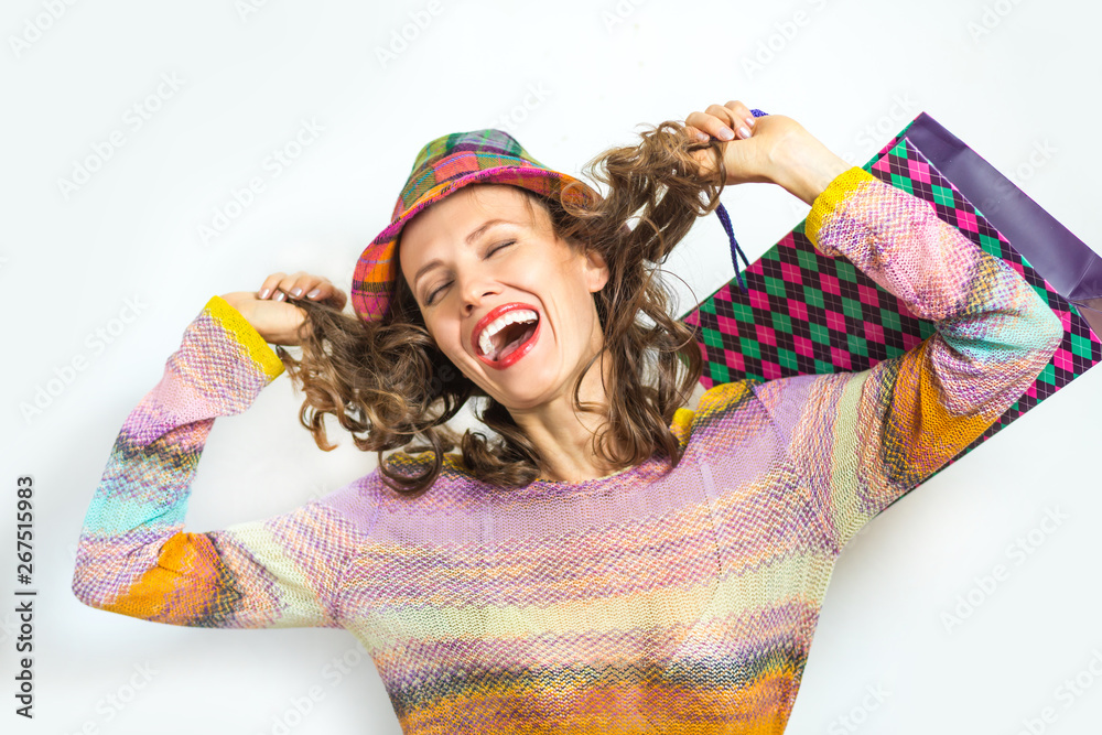 Crazy shopping woman with shopping bags isolated over white background