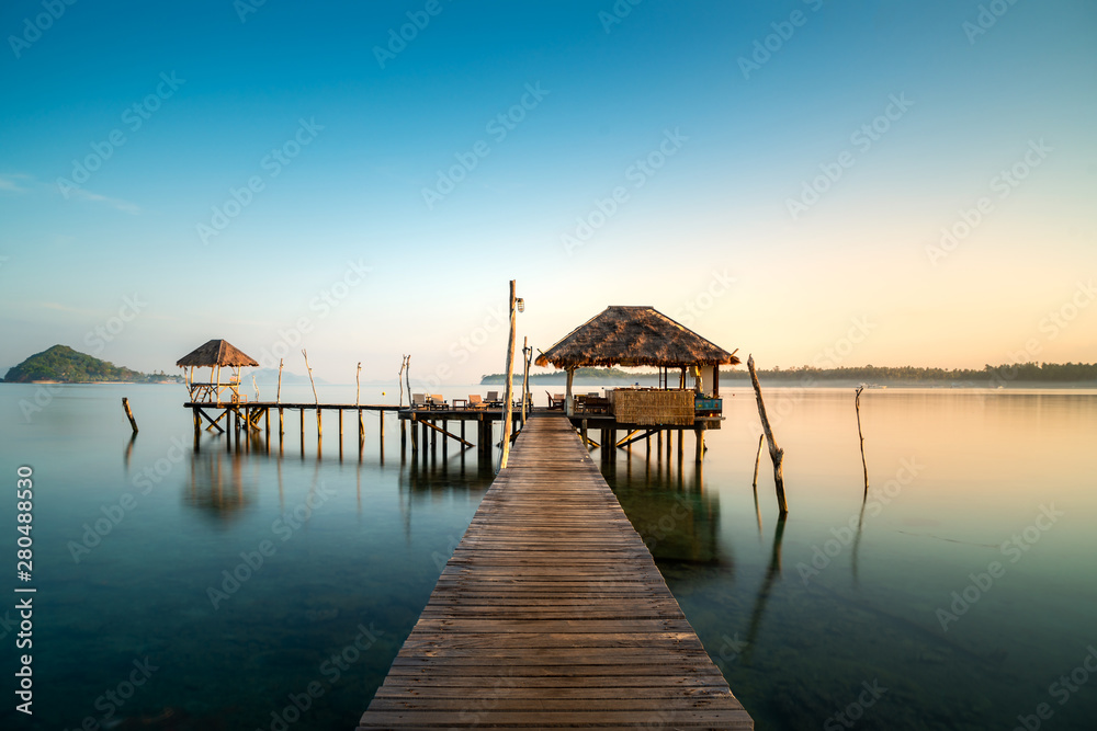 Wooden bar in sea and hut with clear sunrise sky in Koh Mak at Trat, Thailand. Summer, Travel, Vacat