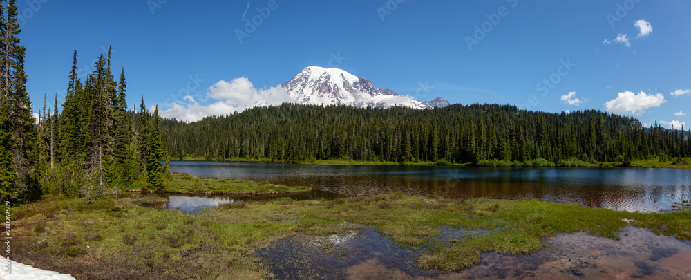 Beautiful Panoramic View of Reflection Lake with Mt Rainier in the background during a sunny summer 