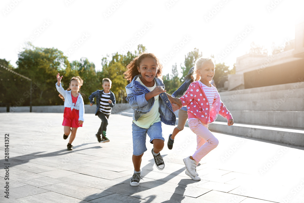 Group of running children outdoors