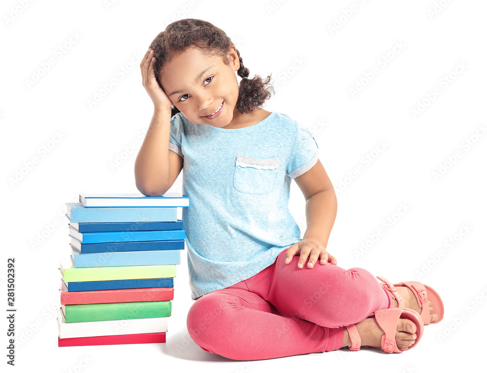 Adorable little African-American schoolgirl with books on white background