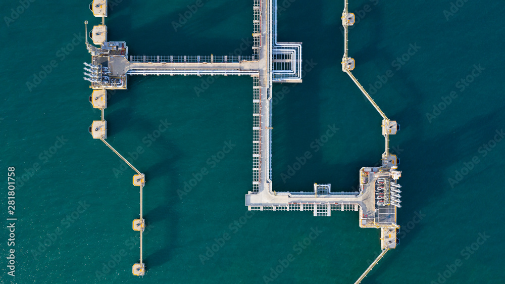 Aerial view crude oil and gas terminal, Loading arm oil and gas refinery at commercial port.