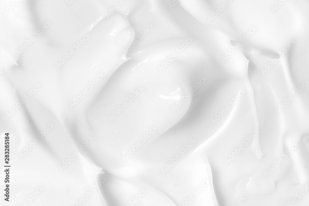 Lotion texture. White skin care cream background. Cosmetic creamy smudge
