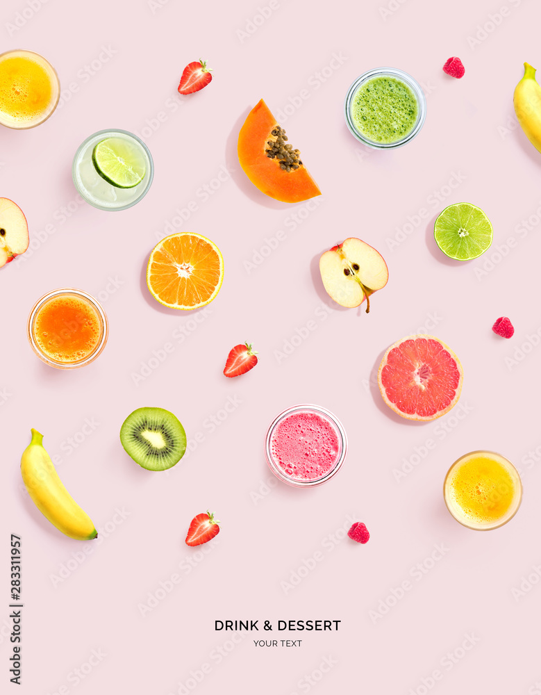 由粉色背景的奶昔、果汁和水果制成的创意布局。平面布局。食品概念。宏观
