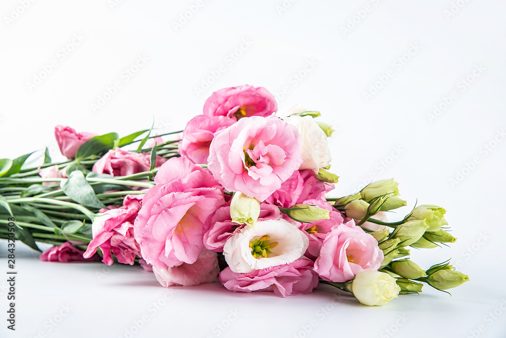 A bouquet of flowers eustoma on a white background