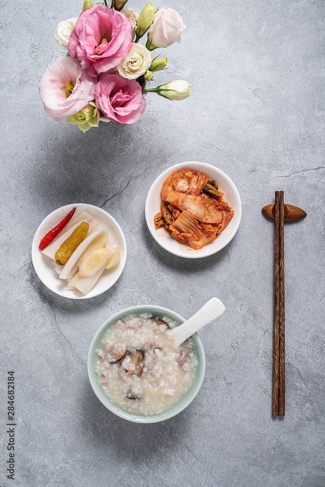 A bowl of shiitake mushroom lean porridge and sour cabbage sour radish