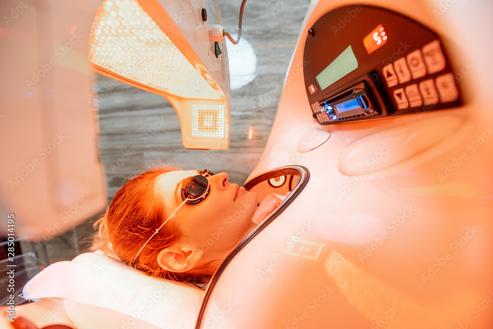 Woman in the spa capsule at the beauty salon