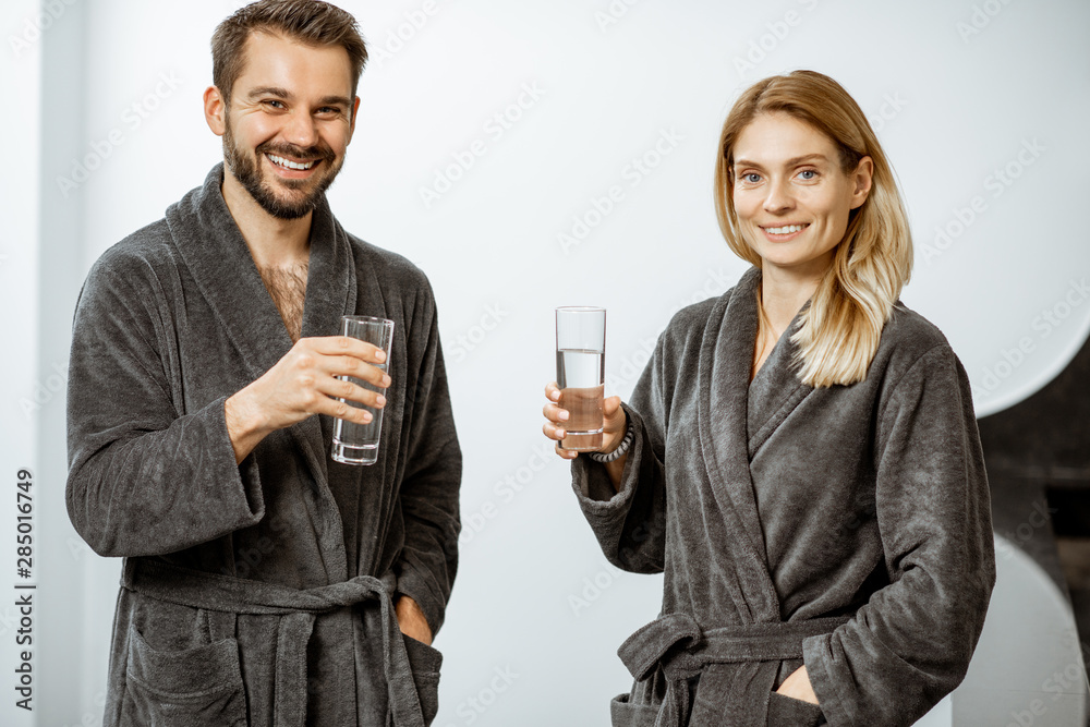 Man and woman with mineral water at the pump-room