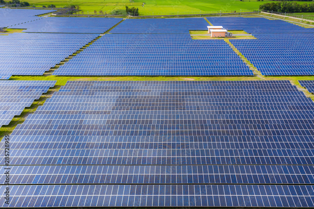 Solar energy farm producing clean renewable energy from the sun . Thousands of solar panels, Photovo