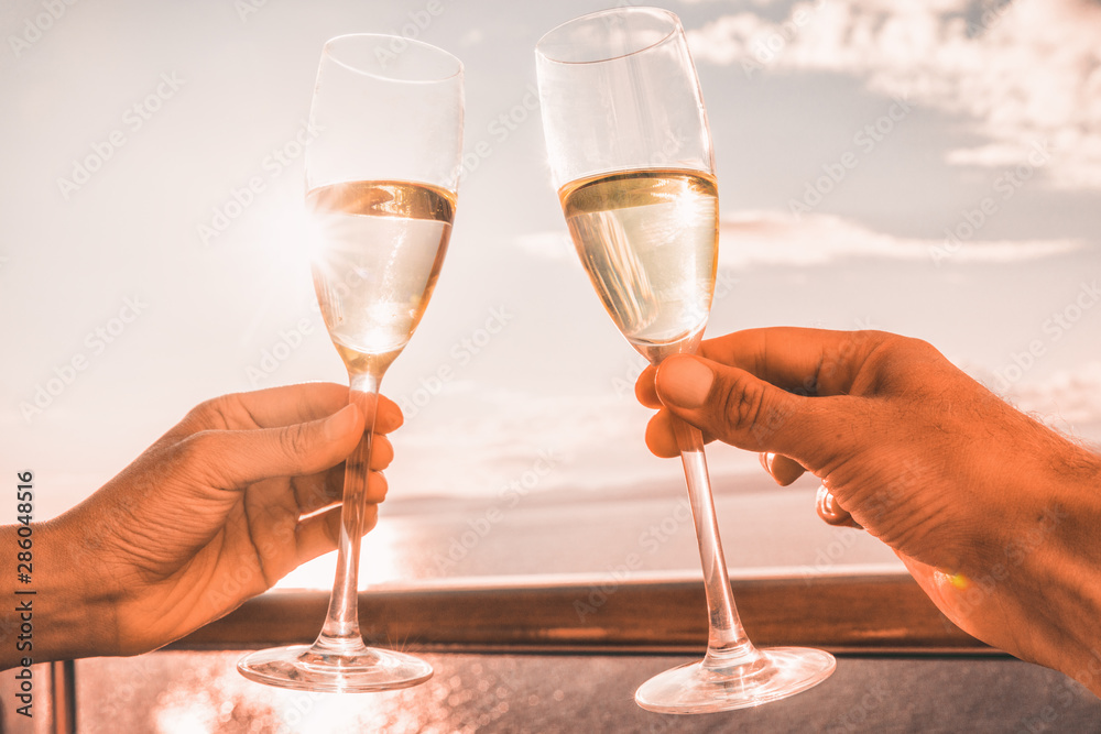 Luxury cruise ship travel couple toasting champagne glasses for celebration honeymoon. Caribbean hol