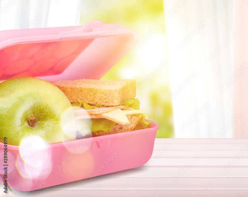 Lunchbox with an apple isolated on background