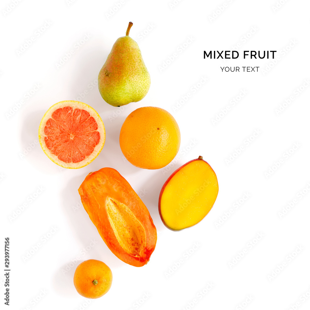 Creative layout made of orange, papaya, grapefruit, mango and pear. Flat lay. Food concept.