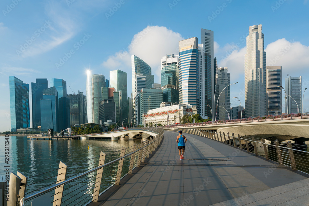 People jogging at morning in Singapore business district skyline financial downtown building with to