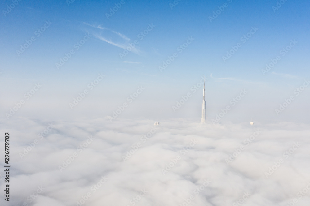 Cityscape of Dubai Downtown skyline on an extremely foggy day when most of worlds tallest skyscrape