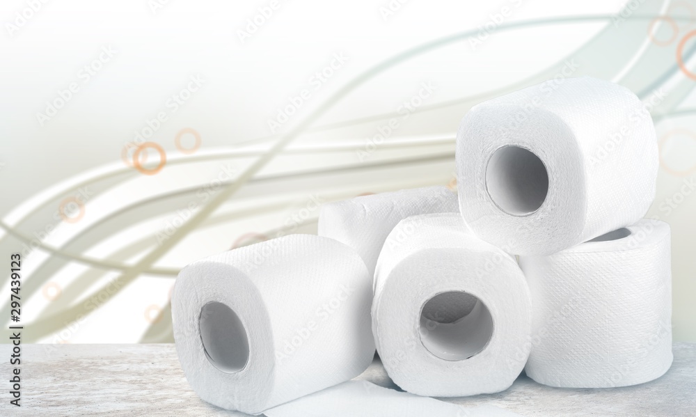 rolls of white toilet paper on table