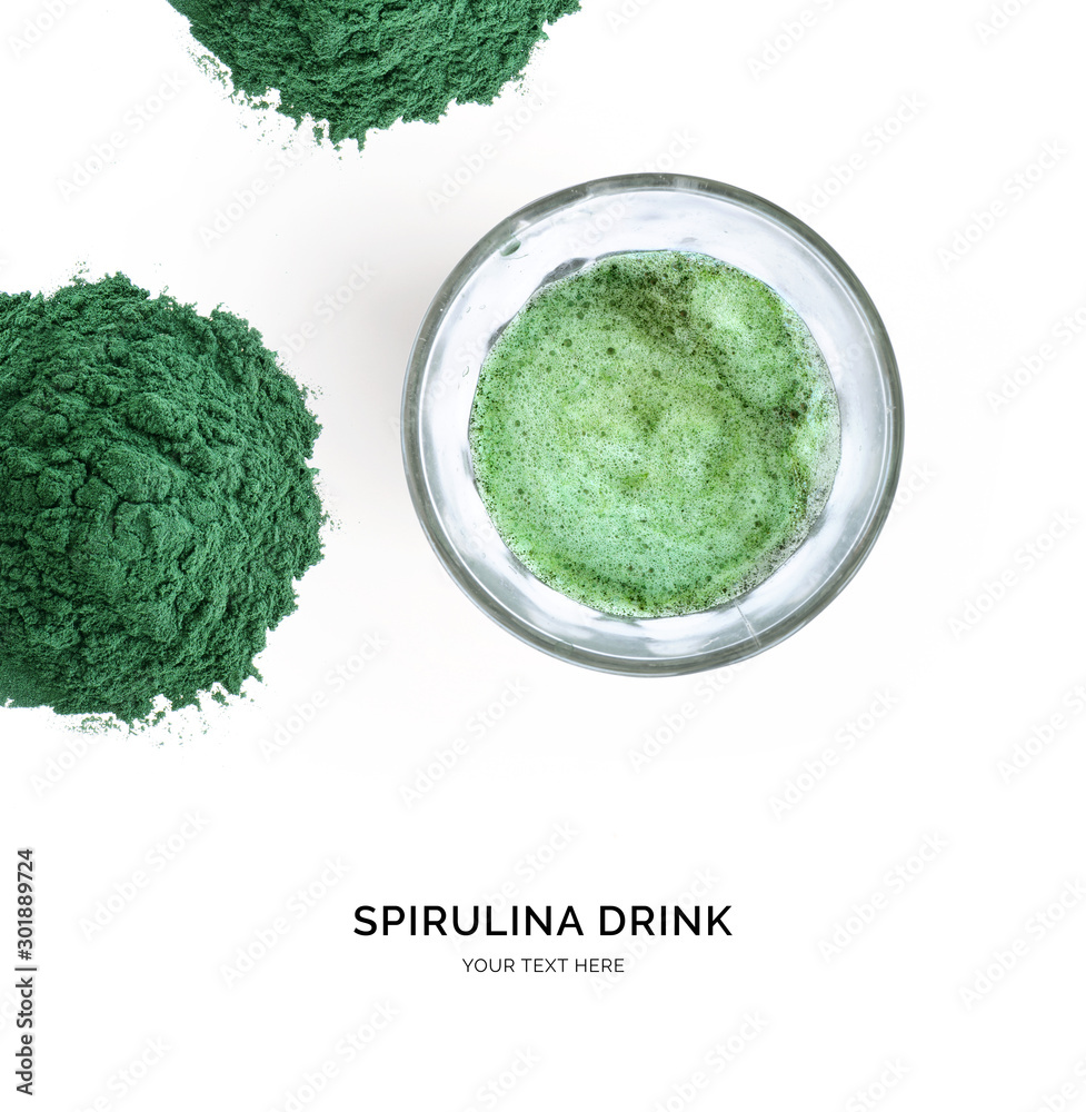 Creative layout made of spirulina powder and spirulina drink on white background. Flat lay. Food con