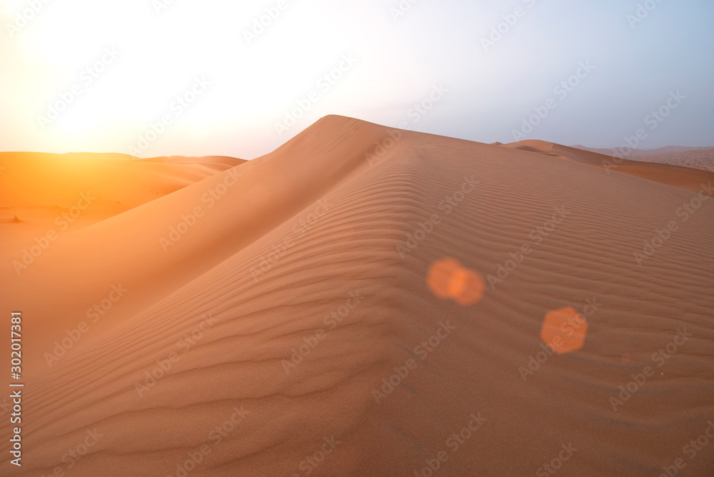 The beauty of the sand dunes in the Sahara Desert in Morocco. The Sahara Desert is the largest hot d