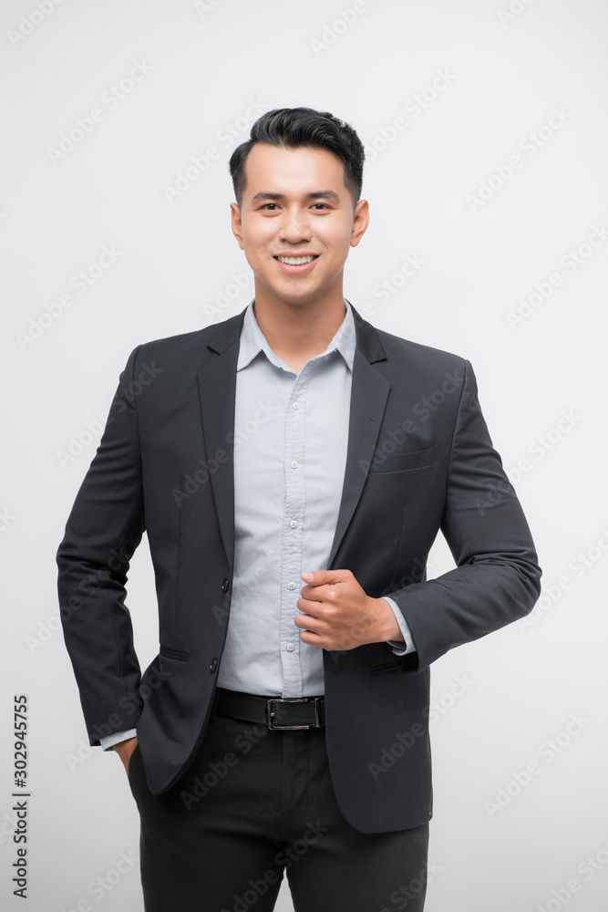 confident and friendly business man portrait - isolated over a white background