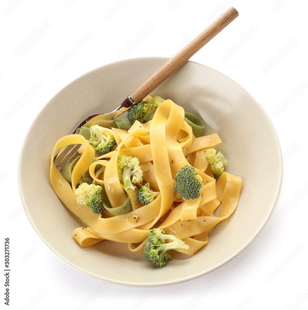 Bowl with tasty pasta and broccoli on white background