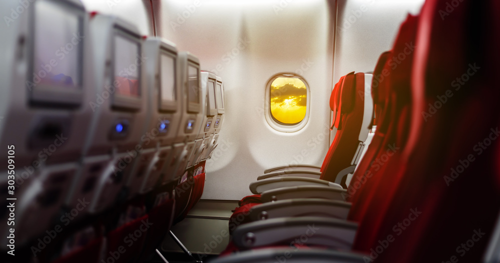 Empty passenger seat in an airplane in red