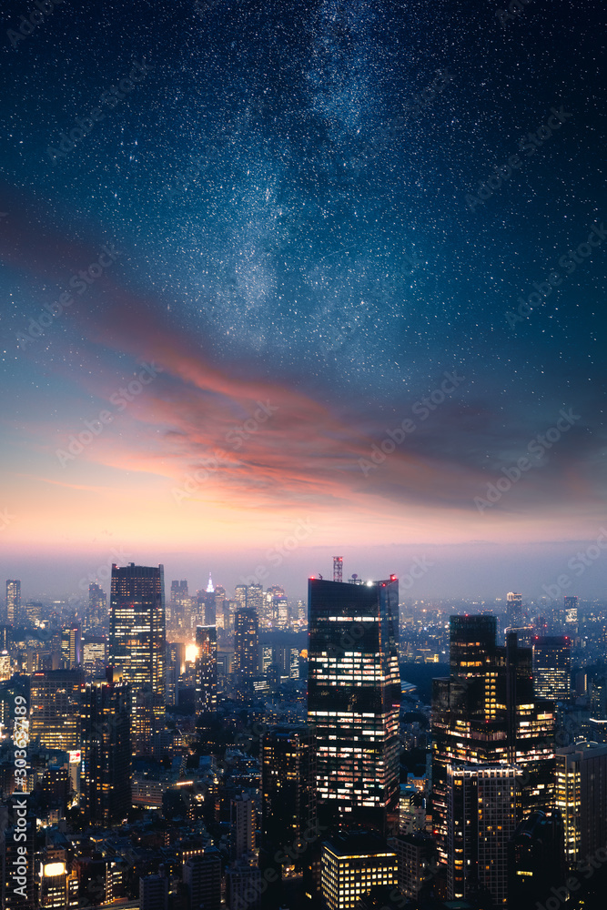 Dramatic cityscape with epic clouds and the stars of the milky way