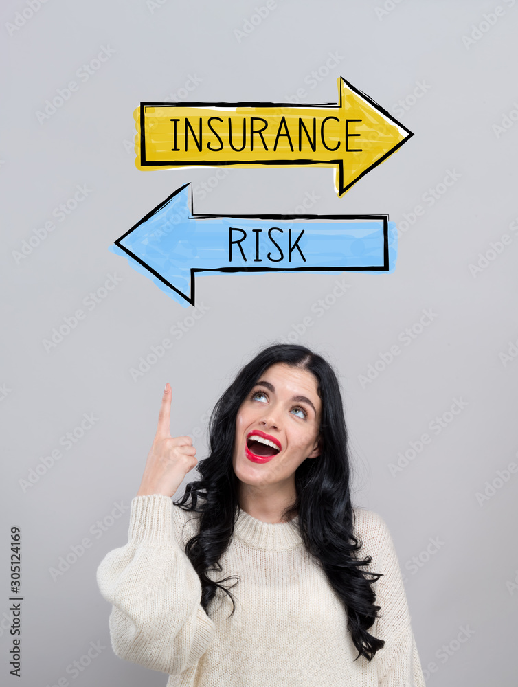 Insurance or risk with happy young woman on a gray background