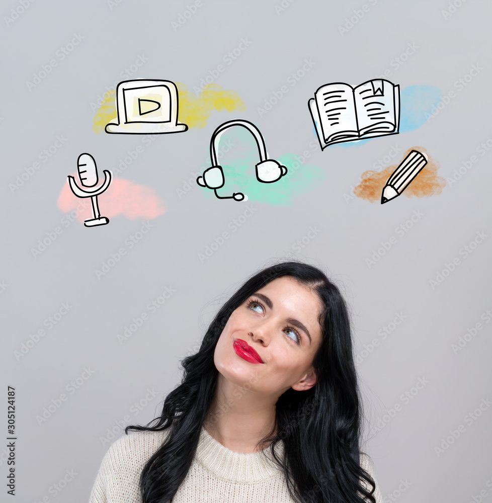 E-Learning concept with happy young woman on a gray background