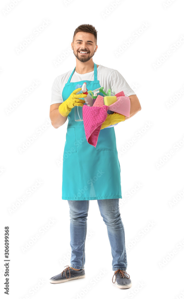 Male janitor with cleaning supplies on white background