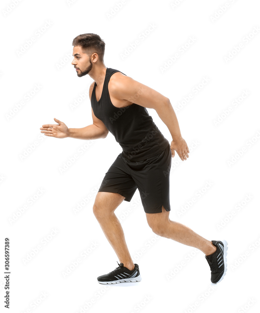 Sporty young man running against white background