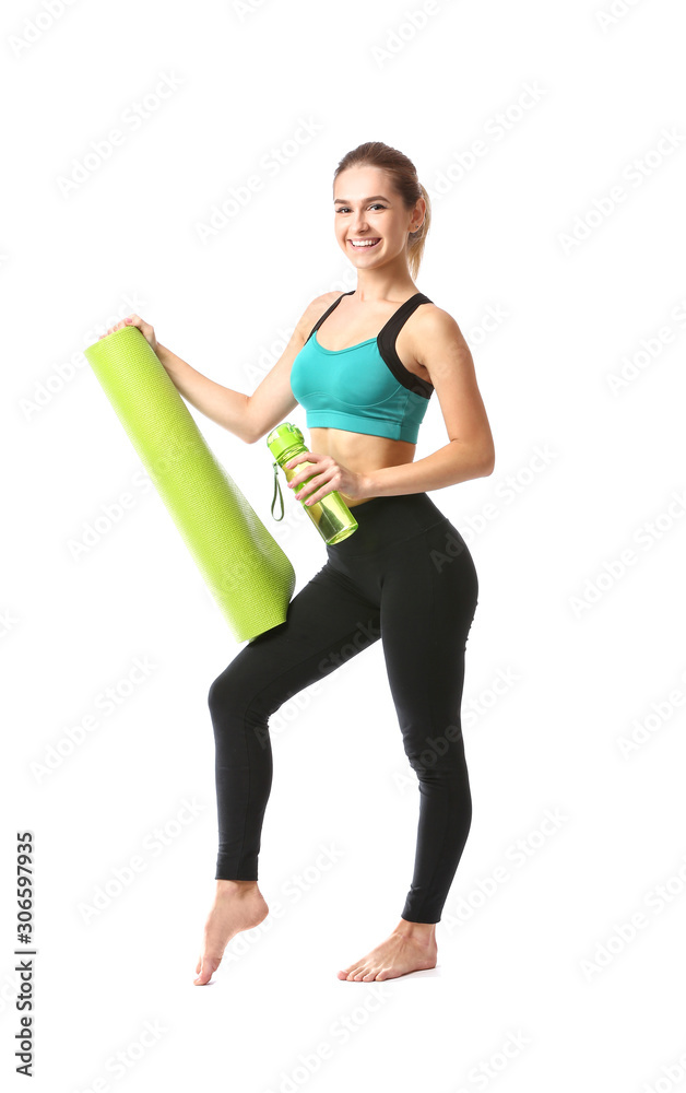 Beautiful young woman with yoga mat and bottle of water on white background