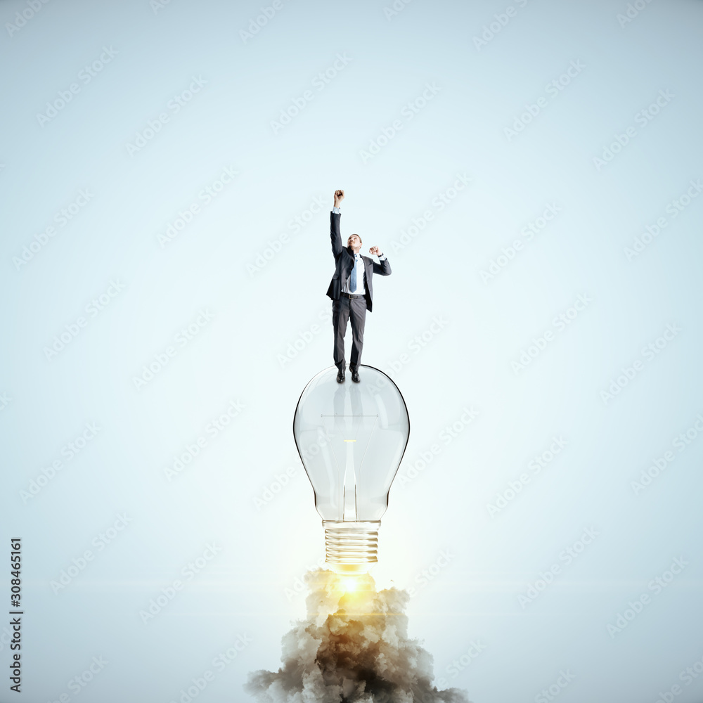Businessman flying with launching lamp