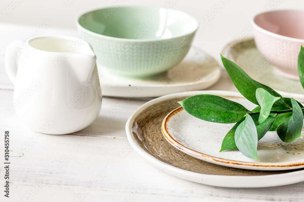 ceramic tableware with flowers on white background