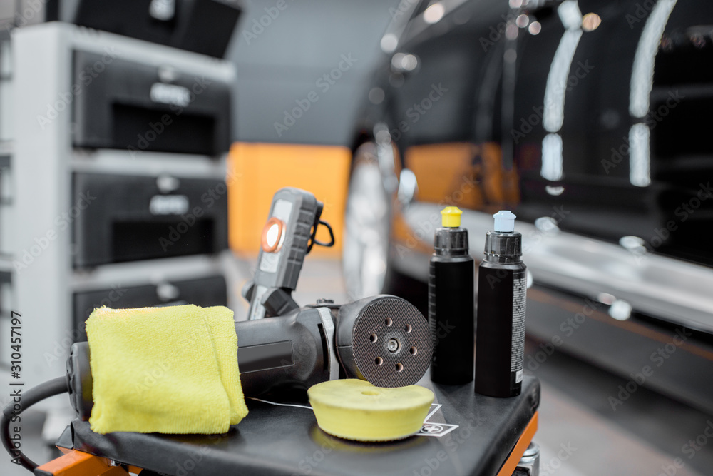 Professional equipment for automotive body polishing at the car service. Car detailing tools for veh