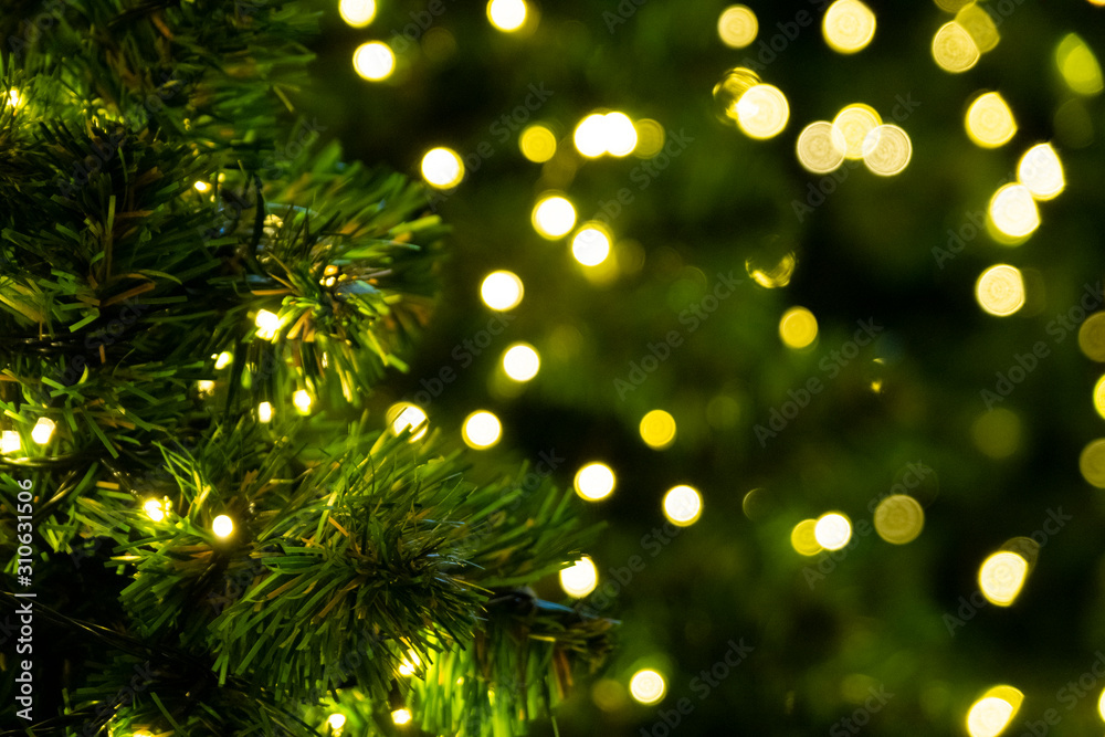 Defocused of yellow bokeh blurred circle light from lighting bulb Merry Christmas   and Happy New Ye