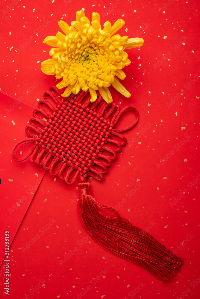Ruyi knot and chrysanthemum on red background