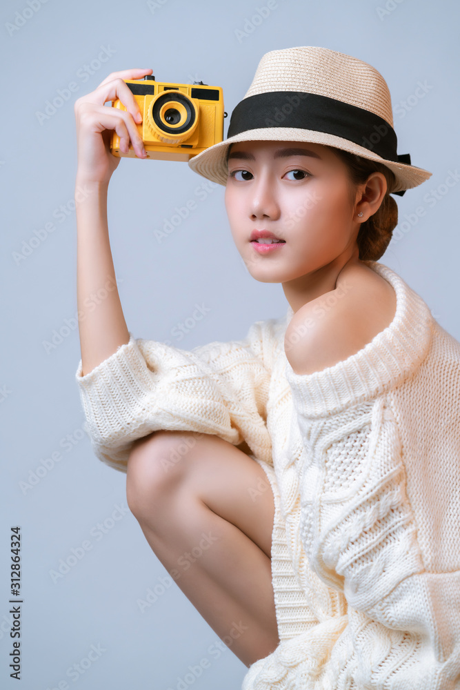 attractive beautiful asian female  casual dress wear hat  hand hold film camera travel vacation conc