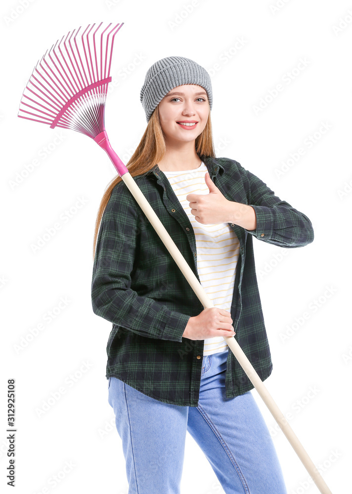 Woman with rake for autumn leaves clean-up on white background
