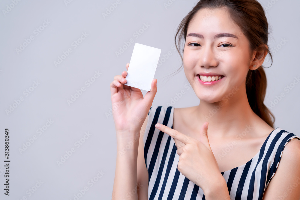smart attractive female asian hand hold credit card with happiness and joyful hand present template 