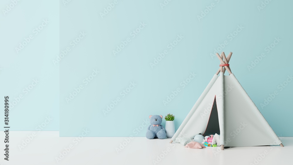 Mock up in childrens playroom with tent and table sitting doll on empty blue wall background.