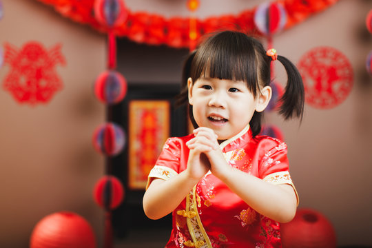 Chinese baby girl with traditional dressing up celebrate Chinese new year